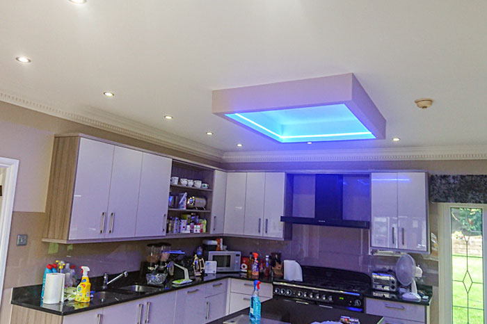 Kitchen installation with unique lighting above island
