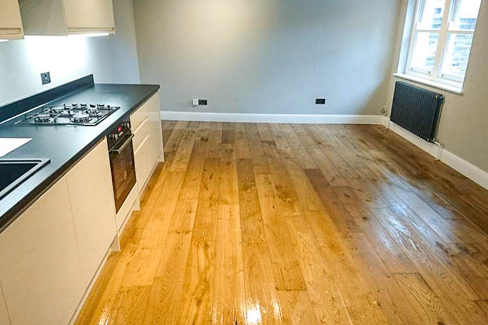 Wooden floor renovation in kitchen installation